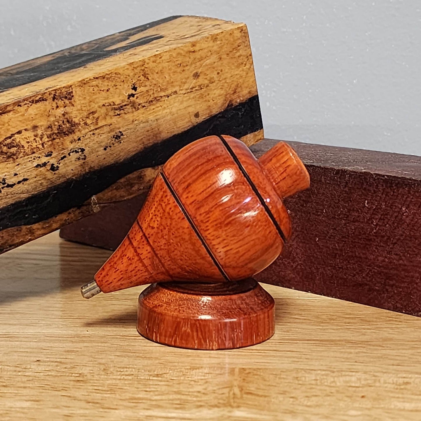 Padauk wood tompo with cord